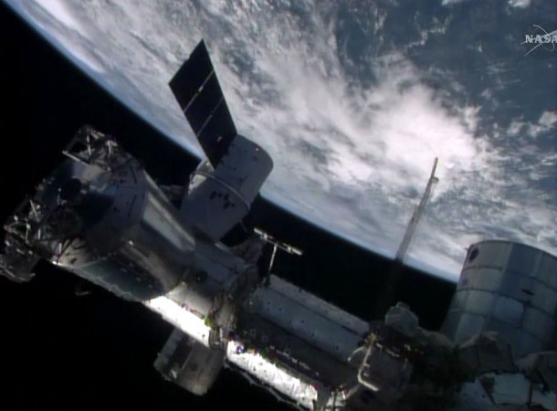 The SpaceX Dragon cargo craft is berthed to the Earth-facing port of the International Space Station's Harmony node. Image Credit: NASA TV The SpaceX Dragon cargo craft is berthed to the Earth-facing port of the International Space Station's Harmony node. Image Credit: NASA TV