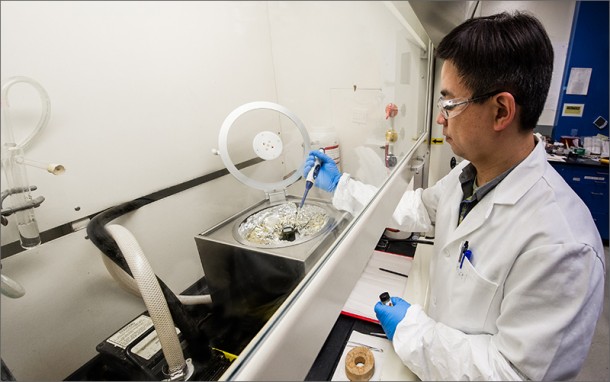 NREL Senior Scientist Kai Zhu prepares a perovskite solar cell in his lab, using a precursor solution that converts from a liquid base to an absorber in a device. Perovskite has shot up the conversion efficiency charts faster than any other solar cell material. Credit: Dennis Schroeder NREL Senior Scientist Kai Zhu prepares a perovskite solar cell in his lab, using a precursor solution that converts from a liquid base to an absorber in a device. Perovskite has shot up the conversion efficiency charts faster than any other solar cell material. Credit: Dennis Schroeder