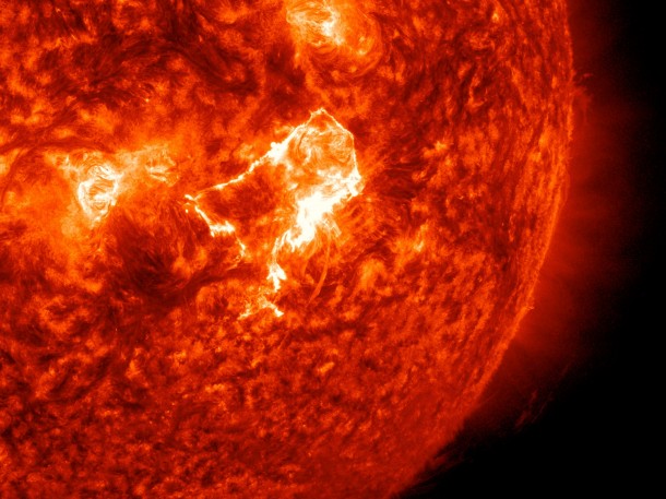 A mid-level flare burst from the sun on April 18, 2014, as seen as a bright spot in the center of this image. The image was captured by NASA's Solar Dynamics Observatory in 304 angstrom. Image Credit: NASA/SDO A mid-level flare burst from the sun on April 18, 2014, as seen as a bright spot in the center of this image. The image was captured by NASA's Solar Dynamics Observatory in 304 angstrom. Image Credit: NASA/SDO