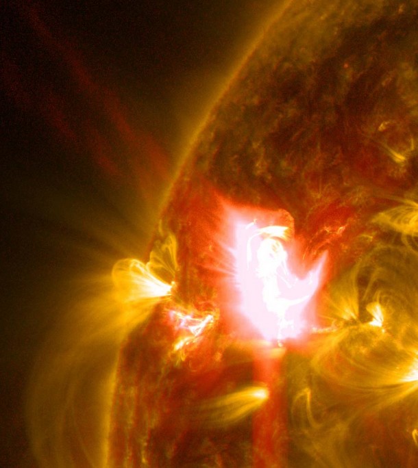 A mid-level flare, an M6.5, erupted from the sun on April 2, 2014, peaking at 10:05 a.m. EDT. This image from NASA's Solar Dynamics Observatory shows the flare in a blend of two wavelengths of extreme ultraviolet light: 131 Angstroms and 171 Angstroms, colorized in yellow and red, respectively. Image Credit: NASA/SDO/Goddard Space Flight Center A mid-level flare, an M6.5, erupted from the sun on April 2, 2014, peaking at 10:05 a.m. EDT. This image from NASA's Solar Dynamics Observatory shows the flare in a blend of two wavelengths of extreme ultraviolet light: 131 Angstroms and 171 Angstroms, colorized in yellow and red, respectively. Image Credit: NASA/SDO/Goddard Space Flight Center