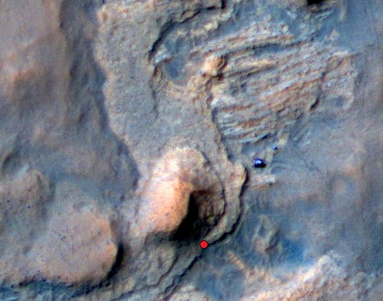In this Mars Reconnaissance Orbiter view of the Curiosity rover mission's waypoint called "the Kimberley," the red dot indicates the location of a sandstone target, "Windjana," selected for close-up inspection. The image was taken April 11, 2014, before the rover arrived at Windjana. Credit: NASA/JPL-Caltech/Univ. of Arizona In this Mars Reconnaissance Orbiter view of the Curiosity rover mission's waypoint called "the Kimberley," the red dot indicates the location of a sandstone target, "Windjana," selected for close-up inspection. The image was taken April 11, 2014, before the rover arrived at Windjana. Credit: NASA/JPL-Caltech/Univ. of Arizona
