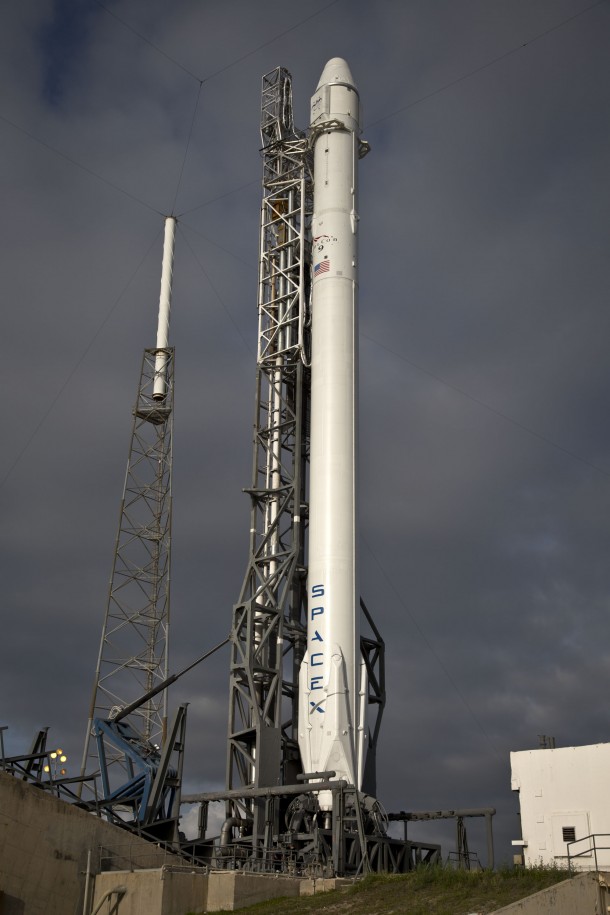 SpaceX Falcon 9 and Dragon are raised vertically at Launch Complex 40 at the Cape Canaveral Air Force Station in Florida prior to launch. Image Credit: SpaceX SpaceX Falcon 9 and Dragon are raised vertically at Launch Complex 40 at the Cape Canaveral Air Force Station in Florida prior to launch. Image Credit: SpaceX