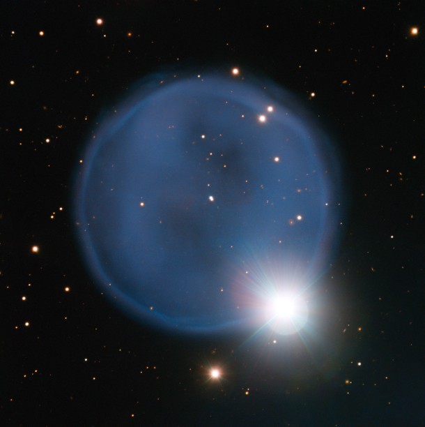 Astronomers using ESO’s Very Large Telescope in Chile have captured this eye-catching image of planetary nebula Abell 33. Created when an aging star blew off its outer layers, this beautiful blue bubble is, by chance, aligned with a foreground star, and bears an uncanny resemblance to a diamond engagement ring. This cosmic gem is unusually symmetric, appearing to be almost perfectly circular on the sky. Credit: ESO Astronomers using ESO’s Very Large Telescope in Chile have captured this eye-catching image of planetary nebula Abell 33. Created when an aging star blew off its outer layers, this beautiful blue bubble is, by chance, aligned with a foreground star, and bears an uncanny resemblance to a diamond engagement ring. This cosmic gem is unusually symmetric, appearing to be almost perfectly circular on the sky. Credit: ESO