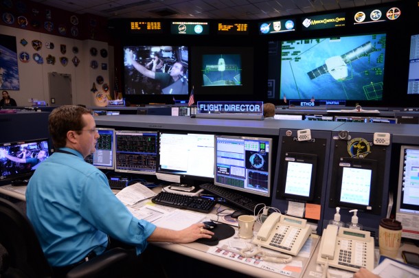 Flight Director Matt Abbott monitors the approach of the SpaceX Dragon from a console in the International Space Station flight control room at Houston's Mission Control Center. Image Credit: NASA Flight Director Matt Abbott monitors the approach of the SpaceX Dragon from a console in the International Space Station flight control room at Houston's Mission Control Center. Image Credit: NASA