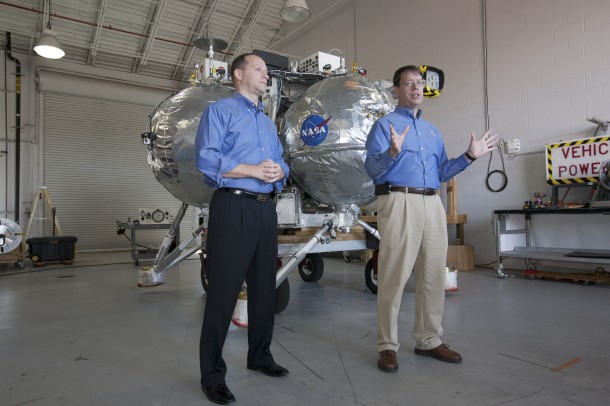 Jon Olansen, Morpheus project manager at Johnson Space Center in Houston, and Greg Gaddis, the Kennedy Morpheus and ALHAT site manager, discuss the lander and its unique systems. Image Credit: NASA/Kim Shiflett Jon Olansen, Morpheus project manager at Johnson Space Center in Houston, and Greg Gaddis, the Kennedy Morpheus and ALHAT site manager, discuss the lander and its unique systems. Image Credit: NASA/Kim Shiflett