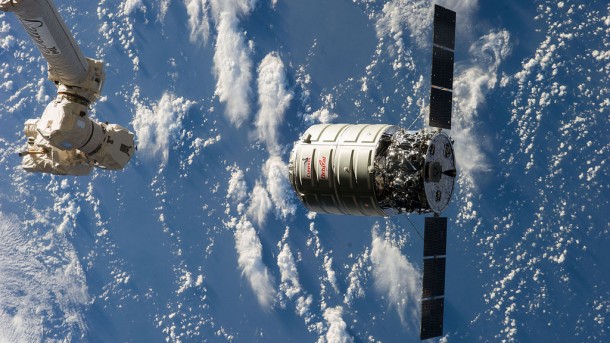 The Cygnus commercial cargo craft, launched by Orbital Sciences, approaches the Canadarm2 before its capture on a previous mission. Image Credit: NASA TV The Cygnus commercial cargo craft, launched by Orbital Sciences, approaches the Canadarm2 before its capture on a previous mission. Image Credit: NASA TV