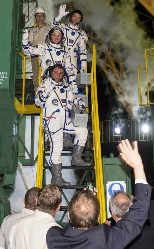Expedition 40 Soyuz Commander Maxim Suraev of the Russian Federal Space Agency, Roscosmos, bottom, Flight Engineer Reid Wiseman of NASA, center, and Flight Engineer Alexander Gerst of the European Space Agency, ESA, top, wave farewell prior to boarding the Soyuz TMA-13M rocket. Image Credit: NASA/Joel Kowsky Expedition 40 Soyuz Commander Maxim Suraev of the Russian Federal Space Agency, Roscosmos, bottom, Flight Engineer Reid Wiseman of NASA, center, and Flight Engineer Alexander Gerst of the European Space Agency, ESA, top, wave farewell prior to boarding the Soyuz TMA-13M rocket. Image Credit: NASA/Joel Kowsky
