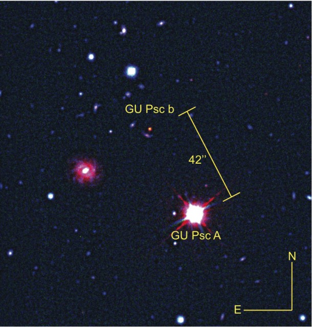 Image 1. The planet GU Psc b and its star GU Psc composed of visible and infrared images from the Gemini South telescope and an infrared image from the CFHT. Because infrared light is invisible to the naked eye, astronomers use a colour code in which infrared light is represented by the colour red. GU Psc b is brighter in infrared than in other filters, which is why it appears red in this image. Image 1. The planet GU Psc b and its star GU Psc composed of visible and infrared images from the Gemini South telescope and an infrared image from the CFHT. Because infrared light is invisible to the naked eye, astronomers use a colour code in which infrared light is represented by the colour red. GU Psc b is brighter in infrared than in other filters, which is why it appears red in this image.