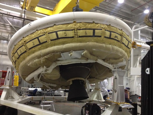 A saucer-shaped test vehicle holding equipment for landing large payloads on Mars is shown in the Missile Assembly Building at the US Navy's Pacific Missile Range Facility in Kaua'i, Hawaii. Image Credit: NASA/JPL-Caltech A saucer-shaped test vehicle holding equipment for landing large payloads on Mars is shown in the Missile Assembly Building at the US Navy's Pacific Missile Range Facility in Kaua'i, Hawaii. Image Credit: NASA/JPL-Caltech
