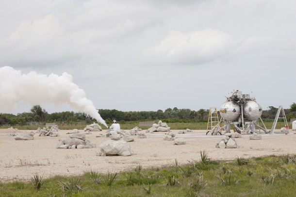 A technician vents off the gas from the propellant lines of NASA's Project Morpheus prototype lander after it completed a free-flight test at the north end of the Shuttle Landing Facility at NASA's Kennedy Space Center in Florida. Image Credit: NASA A technician vents off the gas from the propellant lines of NASA's Project Morpheus prototype lander after it completed a free-flight test at the north end of the Shuttle Landing Facility at NASA's Kennedy Space Center in Florida. Image Credit: NASA