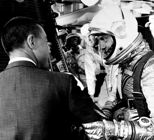 Alan Shepard speaks with Gus Grissom (on left, back to camera), prior to climbing aboard his Freedom 7 capsule for his Mercury-Redstone 3 mission on May 5, 1961. John Glenn (behind Shepard) waits to help strap Shepard into the spacecraft. Image Credit: NASA Alan Shepard speaks with Gus Grissom (on left, back to camera), prior to climbing aboard his Freedom 7 capsule for his Mercury-Redstone 3 mission on May 5, 1961. John Glenn (behind Shepard) waits to help strap Shepard into the spacecraft. Image Credit: NASA