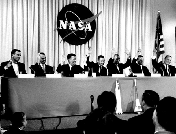 During the April 9, 1959 news conference that introduced the Mercury astronauts, they were asked, "Who wants to be the first man launched into space?" all seven raised their hands -- Walter Schirra and John Glenn raising both hands. From the left, are Donald Slayton, Alan Shepard, Schirra, Gus Grissom, Glenn, Gordon Cooper and Scott Carpenter. Image Credit: NASA During the April 9, 1959 news conference that introduced the Mercury astronauts, they were asked, "Who wants to be the first man launched into space?" all seven raised their hands -- Walter Schirra and John Glenn raising both hands. From the left, are Donald Slayton, Alan Shepard, Schirra, Gus Grissom, Glenn, Gordon Cooper and Scott Carpenter. Image Credit: NASA