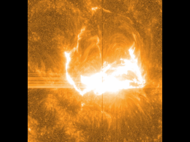 Like almost all solar observatories, NASA's IRIS can provide images of different layers of the sun's atmosphere, which together create a whole picture of what's happening. This image shows light at a wavelength of 1400 Angstrom, which highlights material some 650 miles above the sun's surface. The vertical line in the middle shows the slit for IRIS's spectrograph, which can separate light into its many wavelengths to provide even more information about the temperature and velocity of material during a flare. Credit: NASA/IRIS/Goddard Space Flight Center Like almost all solar observatories, NASA's IRIS can provide images of different layers of the sun's atmosphere, which together create a whole picture of what's happening. This image shows light at a wavelength of 1400 Angstrom, which highlights material some 650 miles above the sun's surface. The vertical line in the middle shows the slit for IRIS's spectrograph, which can separate light into its many wavelengths to provide even more information about the temperature and velocity of material during a flare. Credit: NASA/IRIS/Goddard Space Flight Center