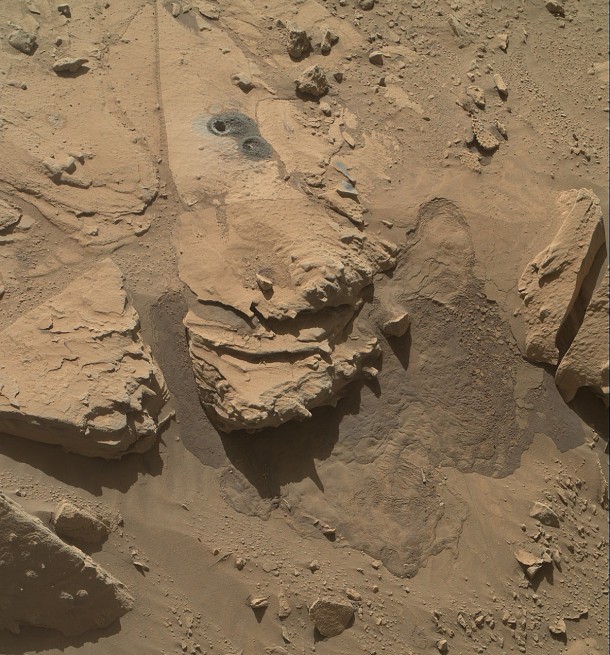 This May 12, 2014, view from the Mars Hand Lens Imager (MAHLI) in NASA's Curiosity Mars Rover shows the rock target "Windjana" and its immediate surroundings after inspection of the site by the rover by drilling and other activities. Image Credit: NASA/JPL-Caltech/MSSS This May 12, 2014, view from the Mars Hand Lens Imager (MAHLI) in NASA's Curiosity Mars Rover shows the rock target "Windjana" and its immediate surroundings after inspection of the site by the rover by drilling and other activities. Image Credit: NASA/JPL-Caltech/MSSS