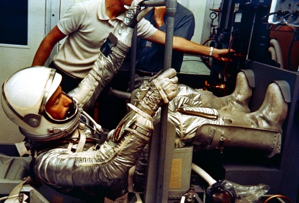 In the Hanger S crew quarters prior to the Mercury Atlas-7 flight in May of 1962, Scott Carpenter participates in a checkout of his pressure suit. Image Credit: NASA In the Hanger S crew quarters prior to the Mercury Atlas-7 flight in May of 1962, Scott Carpenter participates in a checkout of his pressure suit. Image Credit: NASA