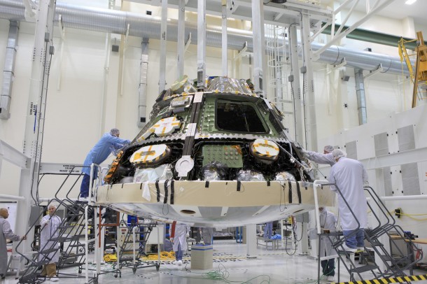 Engineers completed installing the heat shield on NASA’s Orion spacecraft ahead of its first trip to space in December. The flight test will send an uncrewed Orion 3,600 miles into space before returning it to Earth for the splashdown in the Pacific Ocean. The heat shield will help protect the Orion crew vehicle from temperatures of about 4,000 degrees Fahrenheit during its reentry into Earth’s atmosphere. Image Credit: NASA/Daniel Casper Engineers completed installing the heat shield on NASA’s Orion spacecraft ahead of its first trip to space in December. The flight test will send an uncrewed Orion 3,600 miles into space before returning it to Earth for the splashdown in the Pacific Ocean. The heat shield will help protect the Orion crew vehicle from temperatures of about 4,000 degrees Fahrenheit during its reentry into Earth’s atmosphere. Image Credit: NASA/Daniel Casper