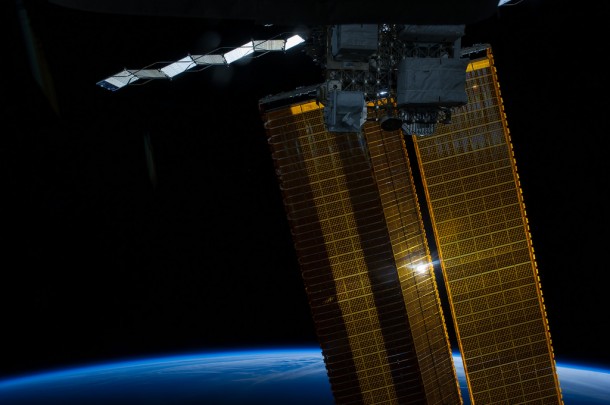Some 228 nautical miles above the home planet, one of the Expedition 40 crew members aboard the International Space Station photographed this view of a sun-kissed solar array wing and a photovoltaic radiator (top) on the orbital outpost on June 3, 2014. Some 228 nautical miles above the home planet, one of the Expedition 40 crew members aboard the International Space Station photographed this view of a sun-kissed solar array wing and a photovoltaic radiator (top) on the orbital outpost on June 3, 2014.