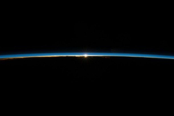 The sun, peeking through the thin line of Earth's atmosphere, is featured in this image photographed by an Expedition 40 crew member on the International Space Station. Image Credit: NASA The sun, peeking through the thin line of Earth's atmosphere, is featured in this image photographed by an Expedition 40 crew member on the International Space Station. Image Credit: NASA