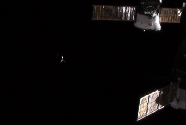 The ISS Progress 53 cargo ship can be seen in the distance following its undocking from the International Space Station. Another Progress and a Soyuz spacecraft, both docked to the station, can be seen on the right. Image Credit: NASA TV The ISS Progress 53 cargo ship can be seen in the distance following its undocking from the International Space Station. Another Progress and a Soyuz spacecraft, both docked to the station, can be seen on the right. Image Credit: NASA TV