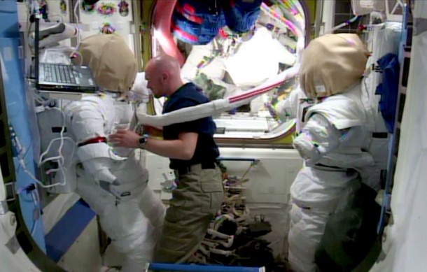 Flight Engineer Alexander Gerst checks out a U.S. spacesuit in the Quest airlock of the International Space Station. Image Credit: NASA TV Flight Engineer Alexander Gerst checks out a U.S. spacesuit in the Quest airlock of the International Space Station. Image Credit: NASA TV