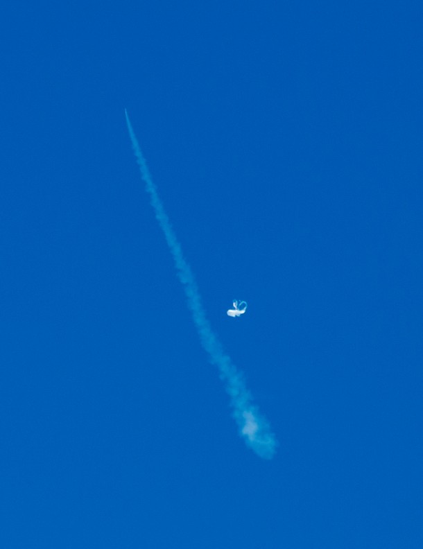 The LDSD test vehicle is unseen at the tip of the slash-like contrail at the upper left of this image. Just to the right of the contrail, and about a third of the way up, is the balloon that carried the saucer. Image Credit: NASA/JPL-Caltech The LDSD test vehicle is unseen at the tip of the slash-like contrail at the upper left of this image. Just to the right of the contrail, and about a third of the way up, is the balloon that carried the saucer. Image Credit: NASA/JPL-Caltech