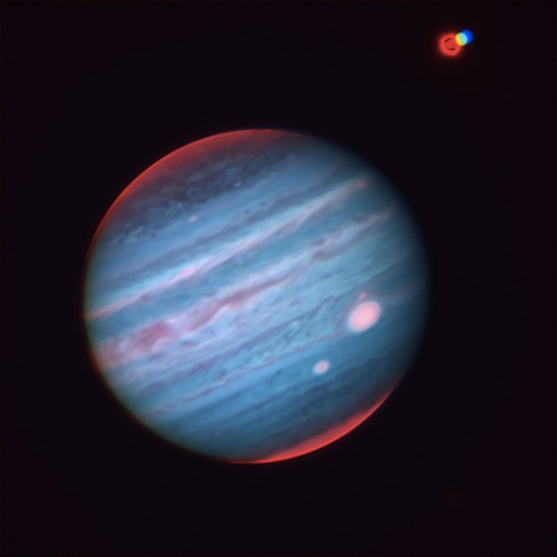 Figure 4: Three-color (JHK) image of Jupiter and Ganymede obtained by Subaru Telescope. Because Ganymede moves with respect to Jupiter during the observations, it appears as three separately colored dots. Image taken at around 5 am, July 27, 2012 in Hawaii Time. Blue color is for J band (1.3 micrometer), green is for H band (1.6 micrometer), and red is for K band (2.2 micrometer), respectively. (Credit: NAOJ/JAXA/Tohoku University) Figure 4: Three-color (JHK) image of Jupiter and Ganymede obtained by Subaru Telescope. Because Ganymede moves with respect to Jupiter during the observations, it appears as three separately colored dots. Image taken at around 5 am, July 27, 2012 in Hawaii Time. Blue color is for J band (1.3 micrometer), green is for H band (1.6 micrometer), and red is for K band (2.2 micrometer), respectively. (Credit: NAOJ/JAXA/Tohoku University)