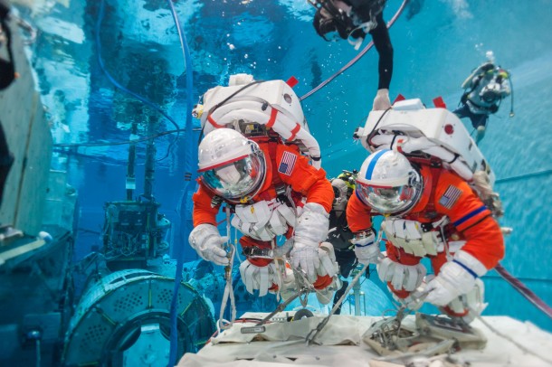 NASA astronauts Stan Love and Stephen Bowen practice microgravity techniques using the new space suits and tools in the Neutral Buoyancy Lab at Johnson Space Center. Image Credit: NASA NASA astronauts Stan Love and Stephen Bowen practice microgravity techniques using the new space suits and tools in the Neutral Buoyancy Lab at Johnson Space Center. Image Credit: NASA