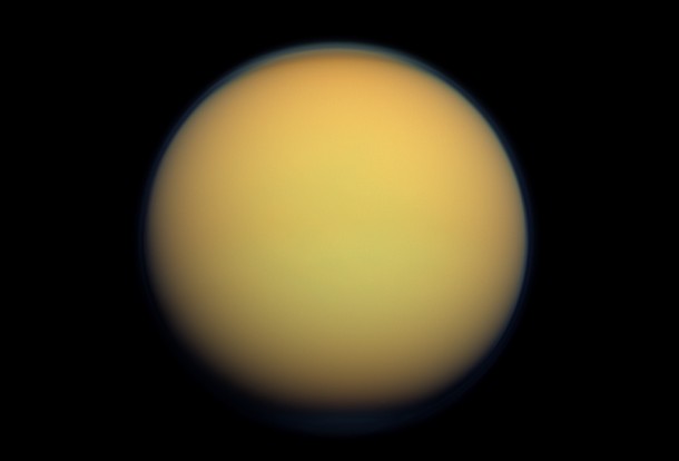 Titan's atmosphere makes Saturn's largest moon look like a fuzzy orange ball in this natural-color view from the Cassini spacecraft. Cassini captured this image in 2012. Image Credit: NASA/JPL-Caltech/Space Science Institute Titan's atmosphere makes Saturn's largest moon look like a fuzzy orange ball in this natural-color view from the Cassini spacecraft. Cassini captured this image in 2012. Image Credit: NASA/JPL-Caltech/Space Science Institute