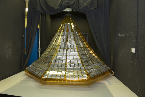 A small canister held the folded solar array system. During testing, the doors and this structure inflated to form a rigid, framework filled with solar cells. Sensors measured the performance of the deployment mechanism and the solar array before, during and after the testing. Image Credit: NASA/MSFC A small canister held the folded solar array system. During testing, the doors and this structure inflated to form a rigid, framework filled with solar cells. Sensors measured the performance of the deployment mechanism and the solar array before, during and after the testing. Image Credit: NASA/MSFC