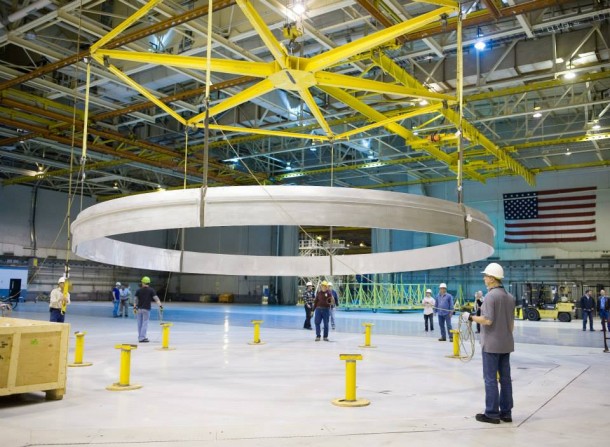 Technicians at NASA's Michoud Assembly Facility in New Orleans lower a qualification ring for the SLS core stage. Image Credit: NASA/MAF Technicians at NASA's Michoud Assembly Facility in New Orleans lower a qualification ring for the SLS core stage. Image Credit: NASA/MAF