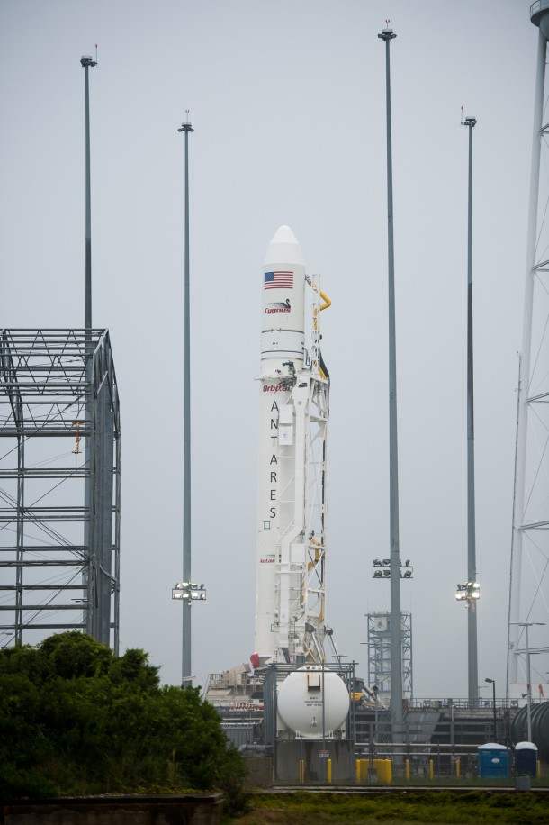 The Orbital Sciences Corporation Antares rocket, with the Cygnus spacecraft onboard, stands vertically at launch Pad-0A after successfully being raised into position for launch, Thursday, July 10, 2014, at NASA's Wallops Flight Facility in Virginia. Image Credit: NASA/Aubrey Gemignani The Orbital Sciences Corporation Antares rocket, with the Cygnus spacecraft onboard, stands vertically at launch Pad-0A after successfully being raised into position for launch, Thursday, July 10, 2014, at NASA's Wallops Flight Facility in Virginia. Image Credit: NASA/Aubrey Gemignani