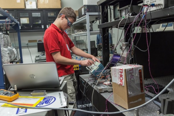 NASA Goddard intern Robert Buttles adjusts equipment used for the eLISA mission, which will test for vibrations that could reveal subtle changes in gravity. Image Credit: NASA Goddard/Kristen Basham NASA Goddard intern Robert Buttles adjusts equipment used for the eLISA mission, which will test for vibrations that could reveal subtle changes in gravity. Image Credit: NASA Goddard/Kristen Basham