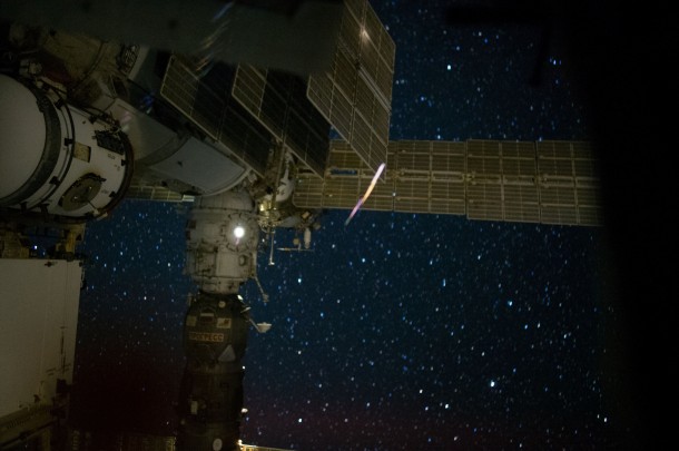 This nighttime view of a portion of the International Space Station's Russian segment is featured in this image photographed by an Expedition 40 crew member on the station. The ISS Progress 55 resupply spacecraft, docked to the Pirs Docking Compartment, is visible at left. Image Credit: NASA This nighttime view of a portion of the International Space Station's Russian segment is featured in this image photographed by an Expedition 40 crew member on the station. The ISS Progress 55 resupply spacecraft, docked to the Pirs Docking Compartment, is visible at left. Image Credit: NASA