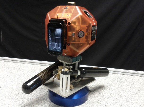 NASA’s Synchronized Position Hold, Engage, Reorient Experimental Satellites (SPHERES) equipped with a smartphone. Image Credit: NASA/Ames NASA’s Synchronized Position Hold, Engage, Reorient Experimental Satellites (SPHERES) equipped with a smartphone. Image Credit: NASA/Ames