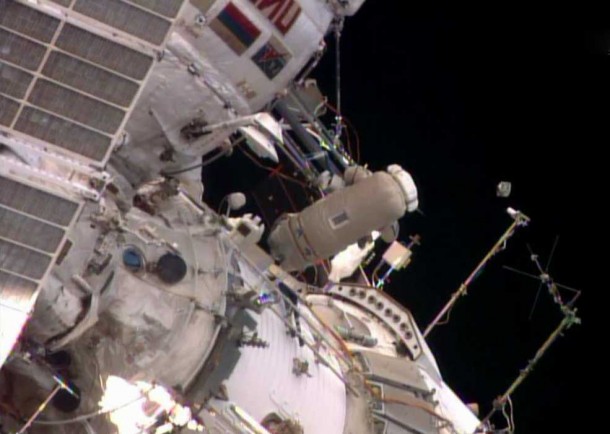 Flight Engineer Oleg Artemyev deploys the Chasqui 1 nanosatellite outside the Pirs docking compartment near the beginning of Monday's spacewalk. Image Credit: NASA TV Flight Engineer Oleg Artemyev deploys the Chasqui 1 nanosatellite outside the Pirs docking compartment near the beginning of Monday's spacewalk. Image Credit: NASA TV