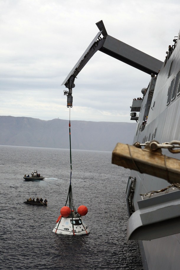 The Orion boilerplate test vehicle is slightly lifted by crane from the water to test the proof of concept basket lift method during an evolution of the Underway Recovery Test 2 near the USS Anchorage in the Pacific Ocean off the coast of San Diego, California on Aug. 3, 2014. Image Credit: NASA/Kim Shiflett The Orion boilerplate test vehicle is slightly lifted by crane from the water to test the proof of concept basket lift method during an evolution of the Underway Recovery Test 2 near the USS Anchorage in the Pacific Ocean off the coast of San Diego, California on Aug. 3, 2014. Image Credit: NASA/Kim Shiflett