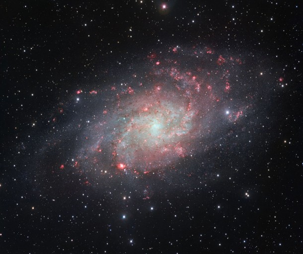The VLT Survey Telescope (VST) at ESO’s Paranal Observatory in Chile has captured this beautifully detailed image of the galaxy Messier 33, often called the Triangulum Galaxy. This nearby spiral, the second closest large galaxy to our own galaxy, the Milky Way, is packed with bright star clusters, and clouds of gas and dust. This picture is amongst the most detailed wide-field views of this object ever taken and shows the many glowing red gas clouds in the spiral arms with particular clarity. Credit: ESO The VLT Survey Telescope (VST) at ESO’s Paranal Observatory in Chile has captured this beautifully detailed image of the galaxy Messier 33, often called the Triangulum Galaxy. This nearby spiral, the second closest large galaxy to our own galaxy, the Milky Way, is packed with bright star clusters, and clouds of gas and dust. This picture is amongst the most detailed wide-field views of this object ever taken and shows the many glowing red gas clouds in the spiral arms with particular clarity. Credit: ESO