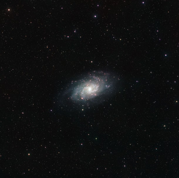This wide field view of the sky around the nearby galaxy Messier 33 was assembled from images forming part of the Digitized Sky Survey 2. The original photographs were taken over a period spanning more than 40 years, from 1949 until the early 1990s. As a result some of the nearer stars in the picture have moved due to their significant proper motions. These show up as double dots — one red and one blue. The huge galaxy at the centre of the picture is tens or hundreds of thousands of times more distant than these nearby stars. Credit: ESO/Digitized Sky Survey 2. Acknowledgement: Davide De Martin This wide field view of the sky around the nearby galaxy Messier 33 was assembled from images forming part of the Digitized Sky Survey 2. The original photographs were taken over a period spanning more than 40 years, from 1949 until the early 1990s. As a result some of the nearer stars in the picture have moved due to their significant proper motions. These show up as double dots — one red and one blue. The huge galaxy at the centre of the picture is tens or hundreds of thousands of times more distant than these nearby stars. Credit: ESO/Digitized Sky Survey 2. Acknowledgement: Davide De Martin