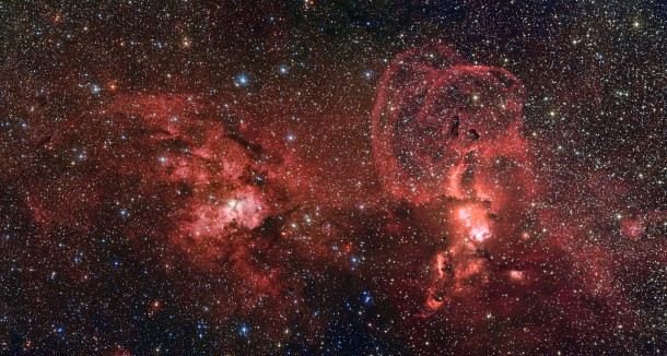 This mosaic of images from the Wide Field Imager on the MPG/ESO 2.2-metre telescope at ESO’s La Silla Observatory in Chile shows two dramatic star formation regions in the southern Milky Way. The first of these, on the left, is dominated by the star cluster NGC 3603, located about 20 000 light-years away, in the Carina–Sagittarius spiral arm of the Milky Way galaxy. The second object, on the right, is a collection of glowing gas clouds known as NGC 3576 that lies only about half as far from Earth. Credit: ESO/G. Beccari This mosaic of images from the Wide Field Imager on the MPG/ESO 2.2-metre telescope at ESO’s La Silla Observatory in Chile shows two dramatic star formation regions in the southern Milky Way. The first of these, on the left, is dominated by the star cluster NGC 3603, located about 20 000 light-years away, in the Carina–Sagittarius spiral arm of the Milky Way galaxy. The second object, on the right, is a collection of glowing gas clouds known as NGC 3576 that lies only about half as far from Earth. Credit: ESO/G. Beccari