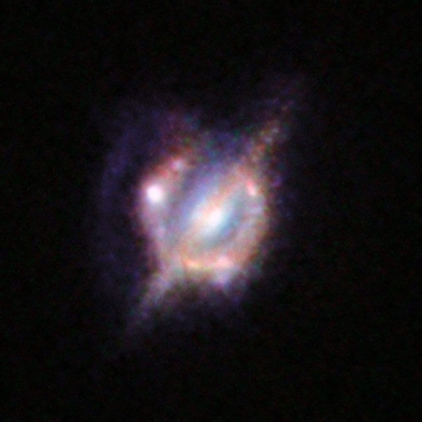 This picture combines the views from the NASA/ESA Hubble Space Telescope and the Keck-II telescope on Hawaii (using adaptive optics). Credit: ESO/NASA/ESA/W. M. Keck Observatory This picture combines the views from the NASA/ESA Hubble Space Telescope and the Keck-II telescope on Hawaii (using adaptive optics). Credit: ESO/NASA/ESA/W. M. Keck Observatory