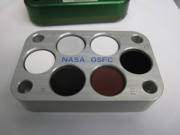 A new carbon-nanotube coating is one of several materials to be tested on the International Space Station as part of the Materials Coating Experiment. The super-black material occupies the “D” slot on the sample tray. Image Credit: NASA/Bill Squicciarini A new carbon-nanotube coating is one of several materials to be tested on the International Space Station as part of the Materials Coating Experiment. The super-black material occupies the “D” slot on the sample tray. Image Credit: NASA/Bill Squicciarini