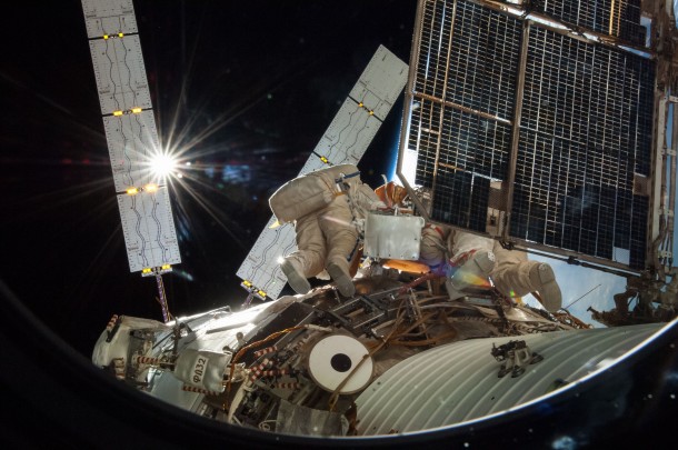 Russian cosmonauts Oleg Artemyev (blue stripes) and Alexander Skvortsov (red stripes, partially obscured), attired in Russian Orlan spacesuits, participate in an Aug. 18 spacewalk outside the International Space Station. Image Credit: NASA Russian cosmonauts Oleg Artemyev (blue stripes) and Alexander Skvortsov (red stripes, partially obscured), attired in Russian Orlan spacesuits, participate in an Aug. 18 spacewalk outside the International Space Station. Image Credit: NASA