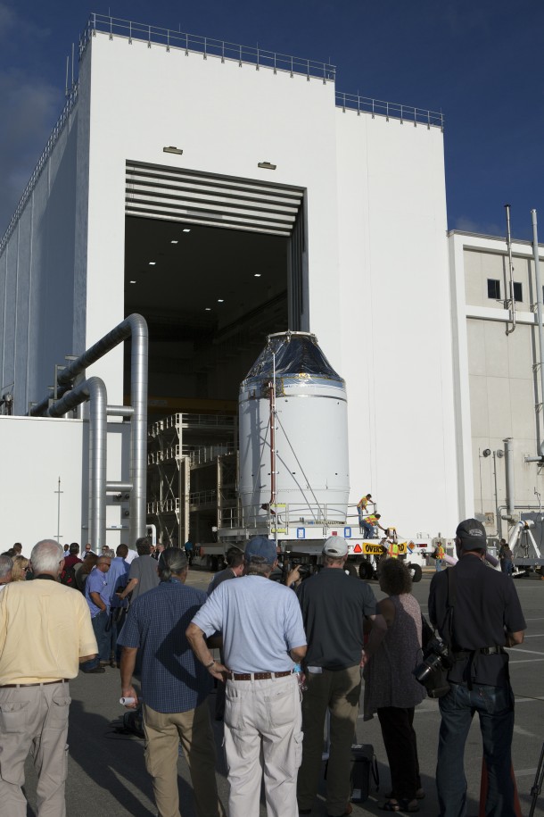 The Orion crew module, stacked atop its service module, moved out of the Neil Armstrong Operations and Checkout Building at NASA’s Kennedy Space Center in Florida on Sept 11. Orion was transported to the Payload Hazardous Servicing Facility at Kennedy where it will be fueled ahead of its December flight test. During the flight, Orion will travel 3,600 miles into space to test the spacecraft systems before humans begin traveling in Orion on future missions. Image Credit: NASA/Dan Casper The Orion crew module, stacked atop its service module, moved out of the Neil Armstrong Operations and Checkout Building at NASA’s Kennedy Space Center in Florida on Sept 11. Orion was transported to the Payload Hazardous Servicing Facility at Kennedy where it will be fueled ahead of its December flight test. During the flight, Orion will travel 3,600 miles into space to test the spacecraft systems before humans begin traveling in Orion on future missions. Image Credit: NASA/Dan Casper