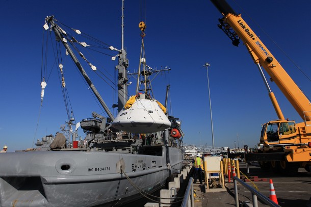 At Naval Base San Diego in California, a crane is used Sept. 11 to transfer the Orion boilerplate test vehicle into the USS Salvor, a safeguard-class rescue and salvage ship that will be used for Underway Recovery Test 4A. The ship will head out to sea for four days to test crew module crane recovery operations. NASA, Lockheed Martin and the U.S. Navy are conducting the test to prepare for recovery of the Orion crew module on its return from a deep space mission. Image Credit: NASA/Kim Shiflett At Naval Base San Diego in California, a crane is used Sept. 11 to transfer the Orion boilerplate test vehicle into the USS Salvor, a safeguard-class rescue and salvage ship that will be used for Underway Recovery Test 4A. The ship will head out to sea for four days to test crew module crane recovery operations. NASA, Lockheed Martin and the U.S. Navy are conducting the test to prepare for recovery of the Orion crew module on its return from a deep space mission. Image Credit: NASA/Kim Shiflett