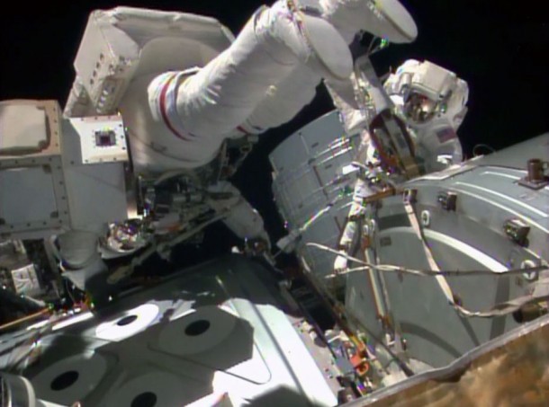 NASA astronauts Reid Wiseman (left) and Barry Wilmore prepare to work atop the International Space Station's Harmony node during Wednesday's spacewalk. Image Credit: NASA TV NASA astronauts Reid Wiseman (left) and Barry Wilmore prepare to work atop the International Space Station's Harmony node during Wednesday's spacewalk. Image Credit: NASA TV