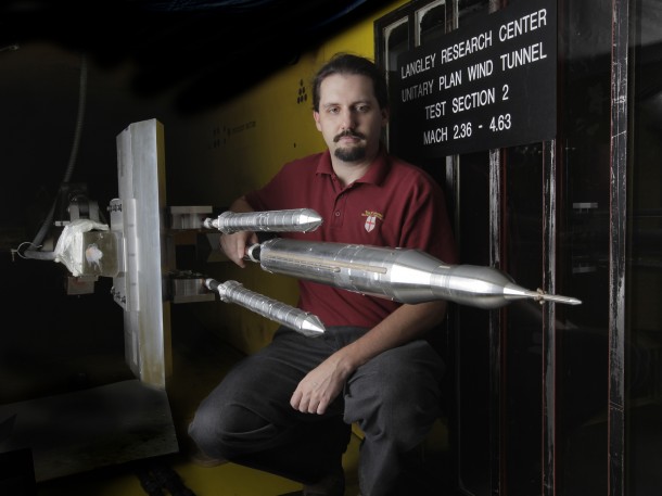 Bryan Falman, a test engineer from NASA’s Langley Research Center in Virginia, observes the Space Launch System (SLS) booster separation 32-inch model after three weeks of testing it in Langley’s Unitary Plan Wind Tunnel. Image Credit: NASA/David C. Bowman Bryan Falman, a test engineer from NASA’s Langley Research Center in Virginia, observes the Space Launch System (SLS) booster separation 32-inch model after three weeks of testing it in Langley’s Unitary Plan Wind Tunnel. Image Credit: NASA/David C. Bowman