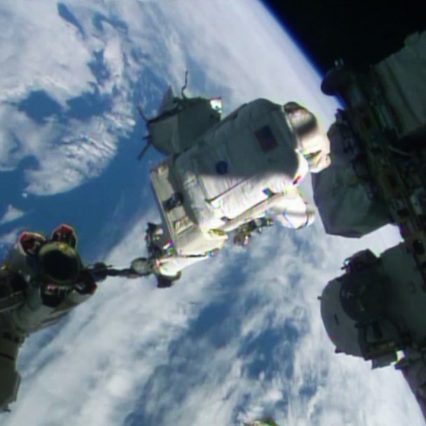 Spacewalker Alexander Gerst rides the Canadarm2 to a work site on the International Space Station. Image Credit: NASA TV Spacewalker Alexander Gerst rides the Canadarm2 to a work site on the International Space Station. Image Credit: NASA TV