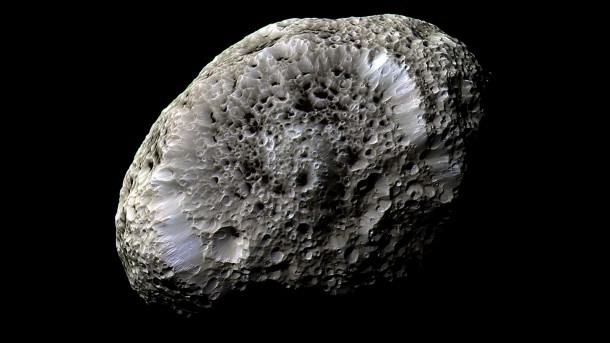 Cassini obtained this false-color view of Saturn's chaotically tumbling moon Hyperion during a flyby on Sept. 26, 2005. The spacecraft detected a strong electrostatic charge on the moon's surface, a first for any body other than Earth's moon. Image credit: NASA/JPL/Space Science Institute Image Credit: NASA/JPL/Space Science Institute Cassini obtained this false-color view of Saturn's chaotically tumbling moon Hyperion during a flyby on Sept. 26, 2005. The spacecraft detected a strong electrostatic charge on the moon's surface, a first for any body other than Earth's moon. Image credit: NASA/JPL/Space Science Institute Image Credit: NASA/JPL/Space Science Institute