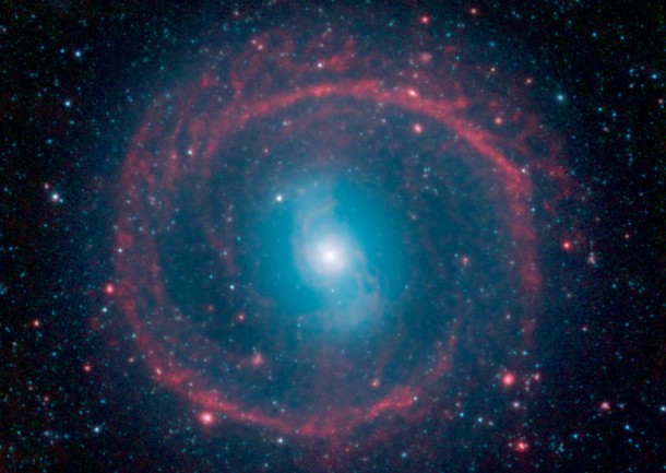 A new image from NASA's Spitzer Space Telescope, taken in infrared light, shows where the action is taking place in galaxy NGC 1291. The outer ring, colored red in this view, is filled with new stars that are igniting and heating up dust that glows with infrared light. Image Credit: NASA/JPL-Caltech A new image from NASA's Spitzer Space Telescope, taken in infrared light, shows where the action is taking place in galaxy NGC 1291. The outer ring, colored red in this view, is filled with new stars that are igniting and heating up dust that glows with infrared light. Image Credit: NASA/JPL-Caltech