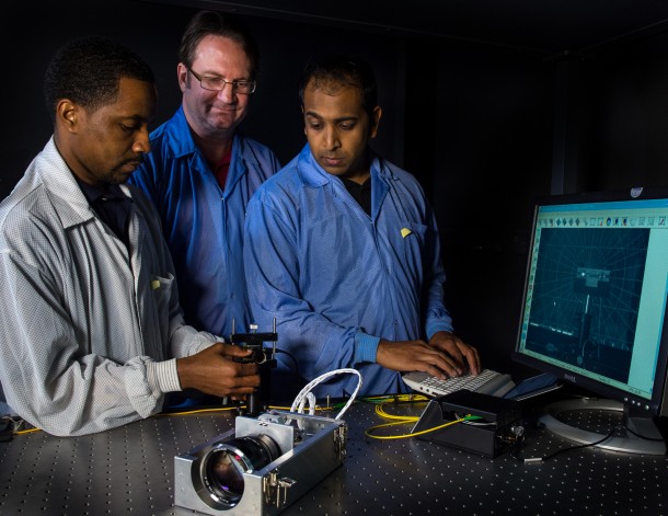 Semper (left), Calhoun, and Shah are advancing the technologies needed to create a virtual telescope that they plan to demonstrate on two CubeSats. Image Credit: NASA/W. Hrybyk Semper (left), Calhoun, and Shah are advancing the technologies needed to create a virtual telescope that they plan to demonstrate on two CubeSats. Image Credit: NASA/W. Hrybyk